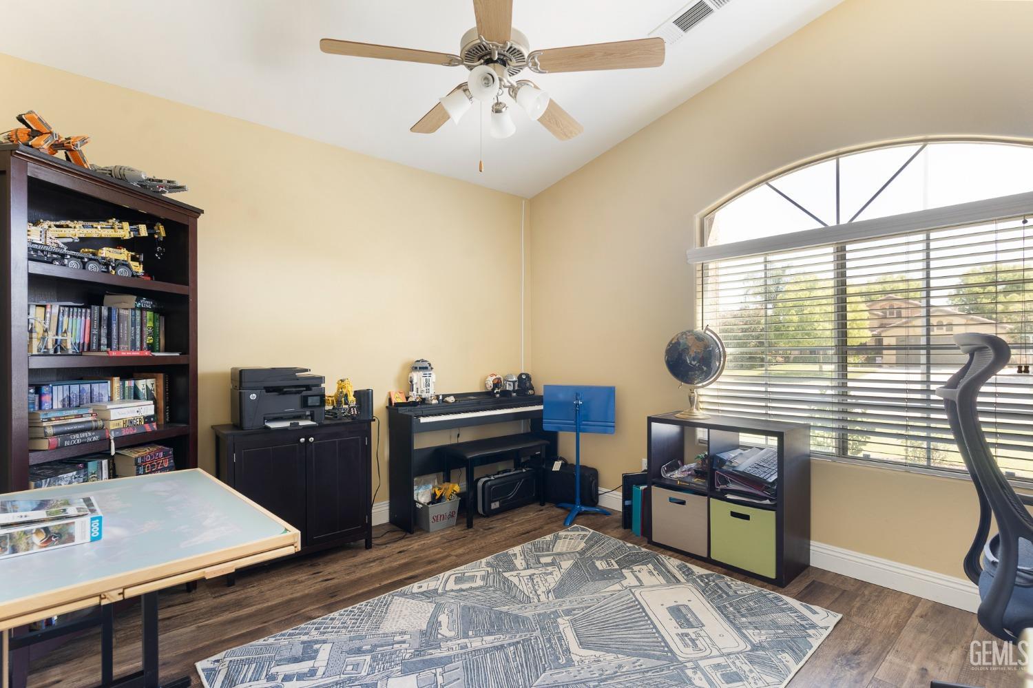 Undisclosed Address Bakersfield, CA 93311 - Photo 15 of 17 a view of a workspace with furniture and a window