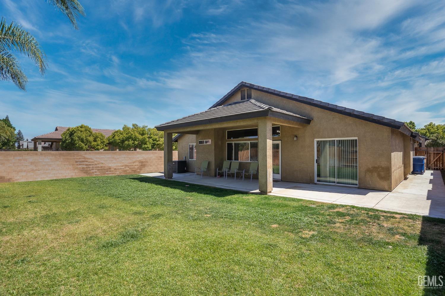 Undisclosed Address Bakersfield, CA 93311 - Photo 17 of 17 a front view of a house with a yard