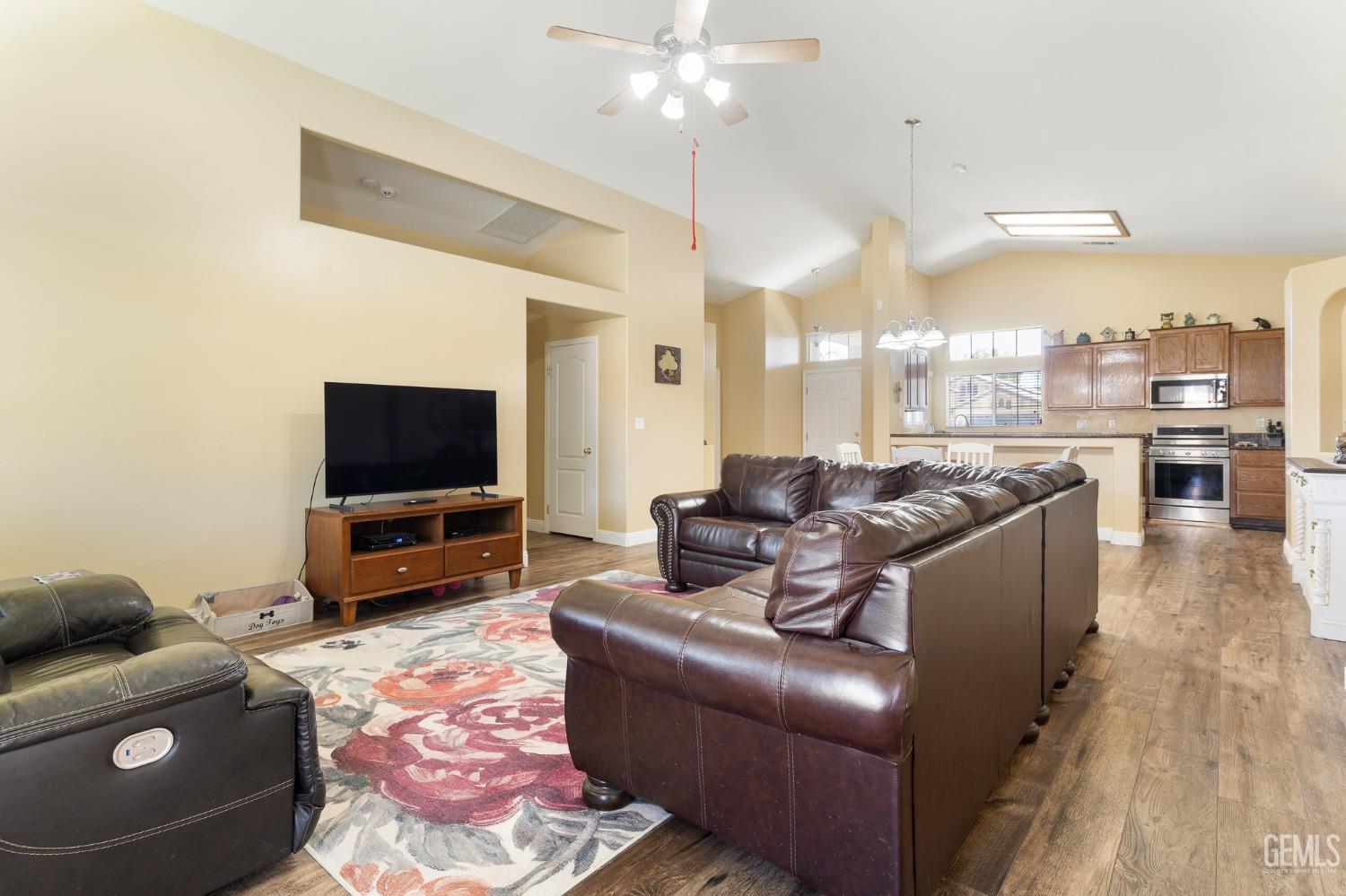 Undisclosed Address Bakersfield, CA 93311 - Photo 4 of 17 a living room with furniture and a flat screen tv