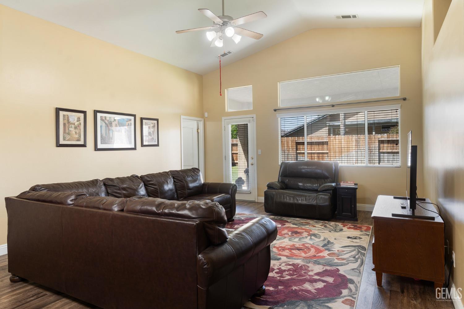 Undisclosed Address Bakersfield, CA 93311 - Photo 5 of 17 a living room with furniture and a flat screen tv