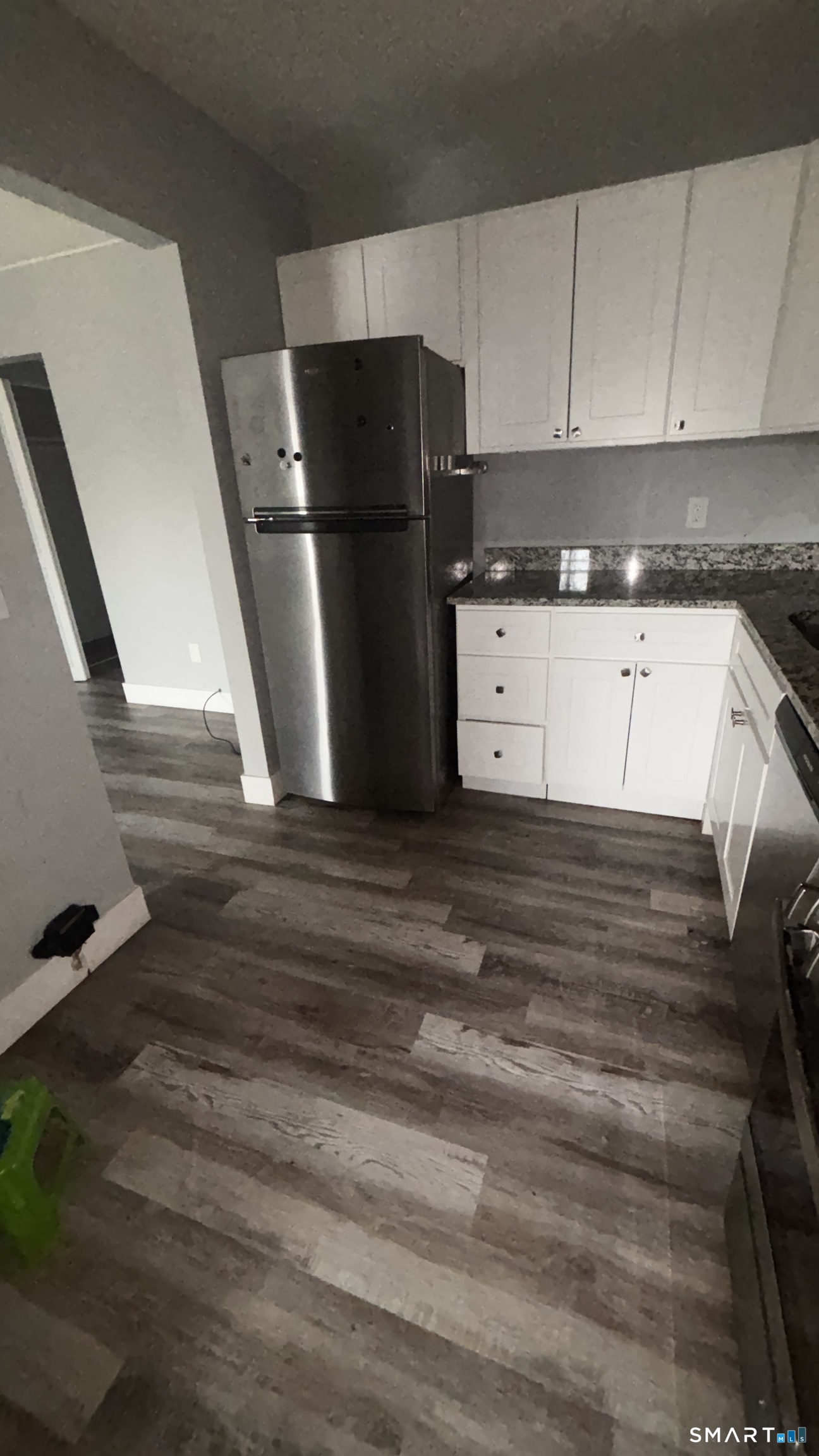 50 Greenhouse Road, Unit 33C Bridgeport, CT 06606 - Photo 25 of 33 a kitchen with refrigerator and cabinets