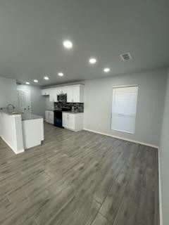 8608 10th Street Lubbock, TX 79416 - Photo 3 of 18 a view of a kitchen with a stove top oven
