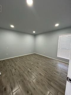 8608 10th Street Lubbock, TX 79416 - Photo 6 of 18 an empty room with wooden floor and windows