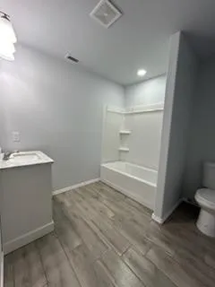 a bathroom with a sink and a toilet
