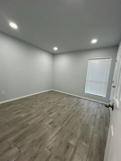 8608 10th Street Lubbock, TX 79416 - Photo 10 of 18 an empty room with wooden floor and windows