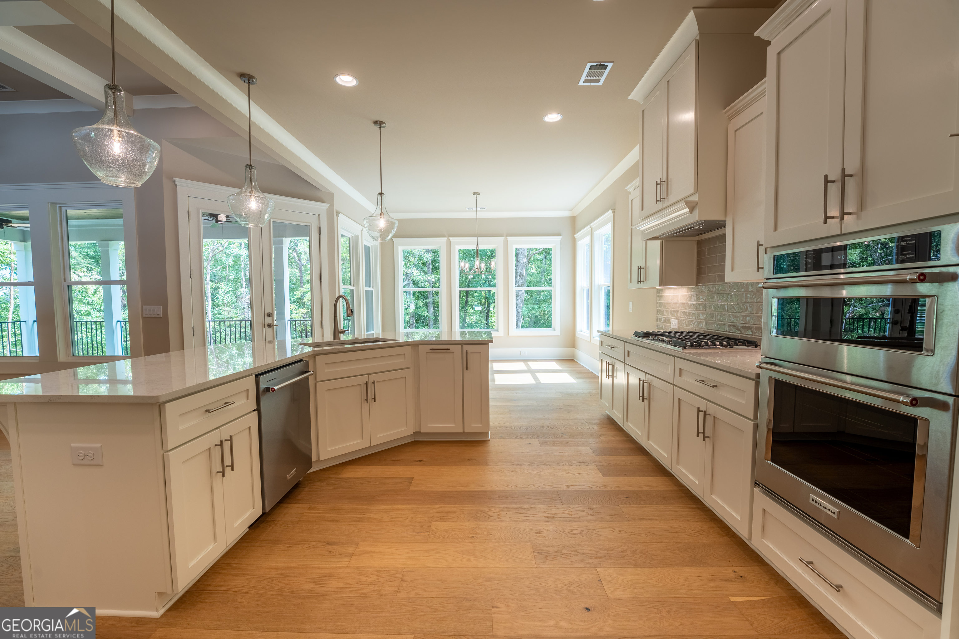 120 Fall Pippin Court Clarkesville, GA 30523 - Photo 15 of 65 a large kitchen with stainless steel appliances kitchen island granite countertop a stove a sink and a refrigerator