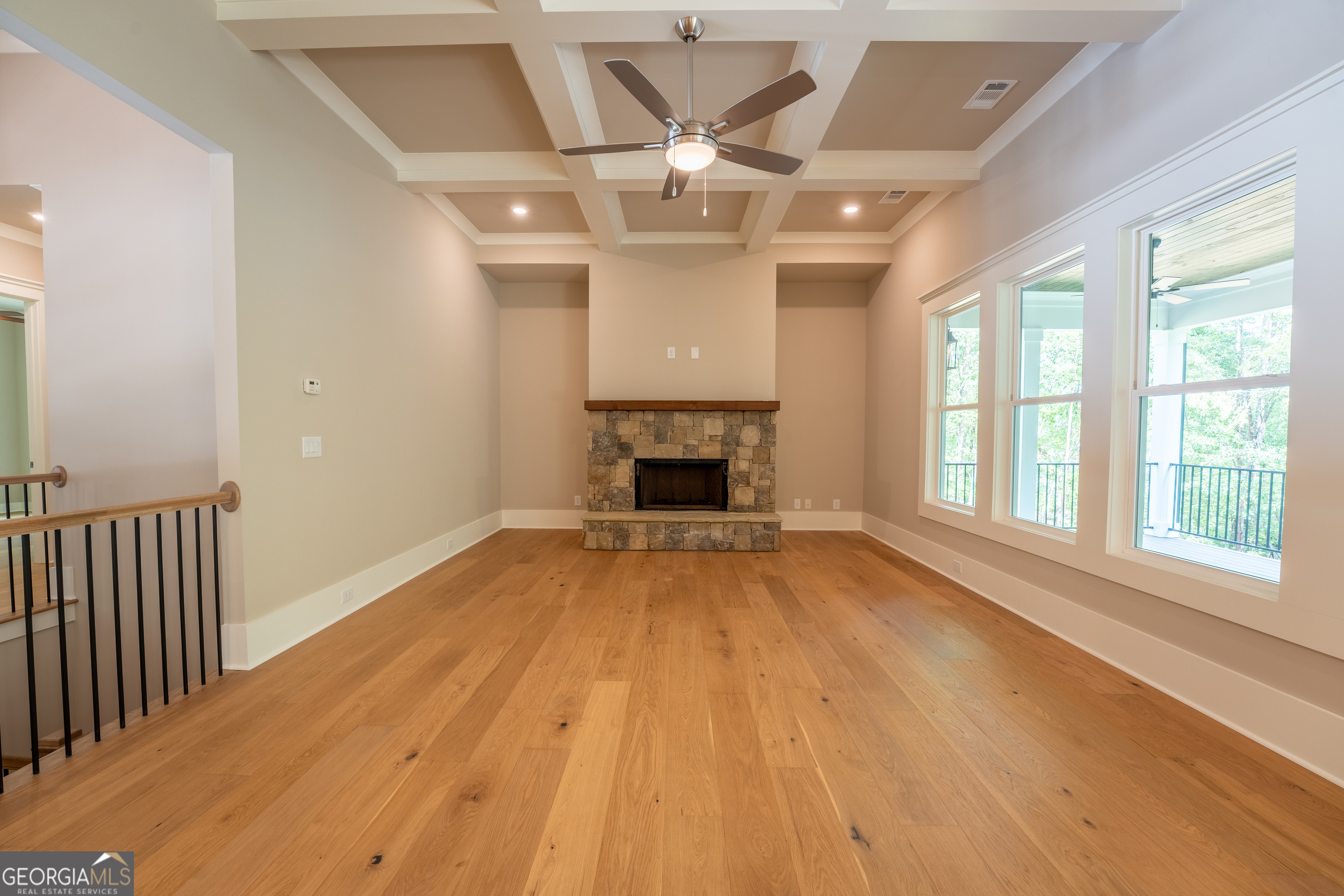 120 Fall Pippin Court Clarkesville, GA 30523 - Photo 17 of 65 a view of an empty room with wooden floor and a window
