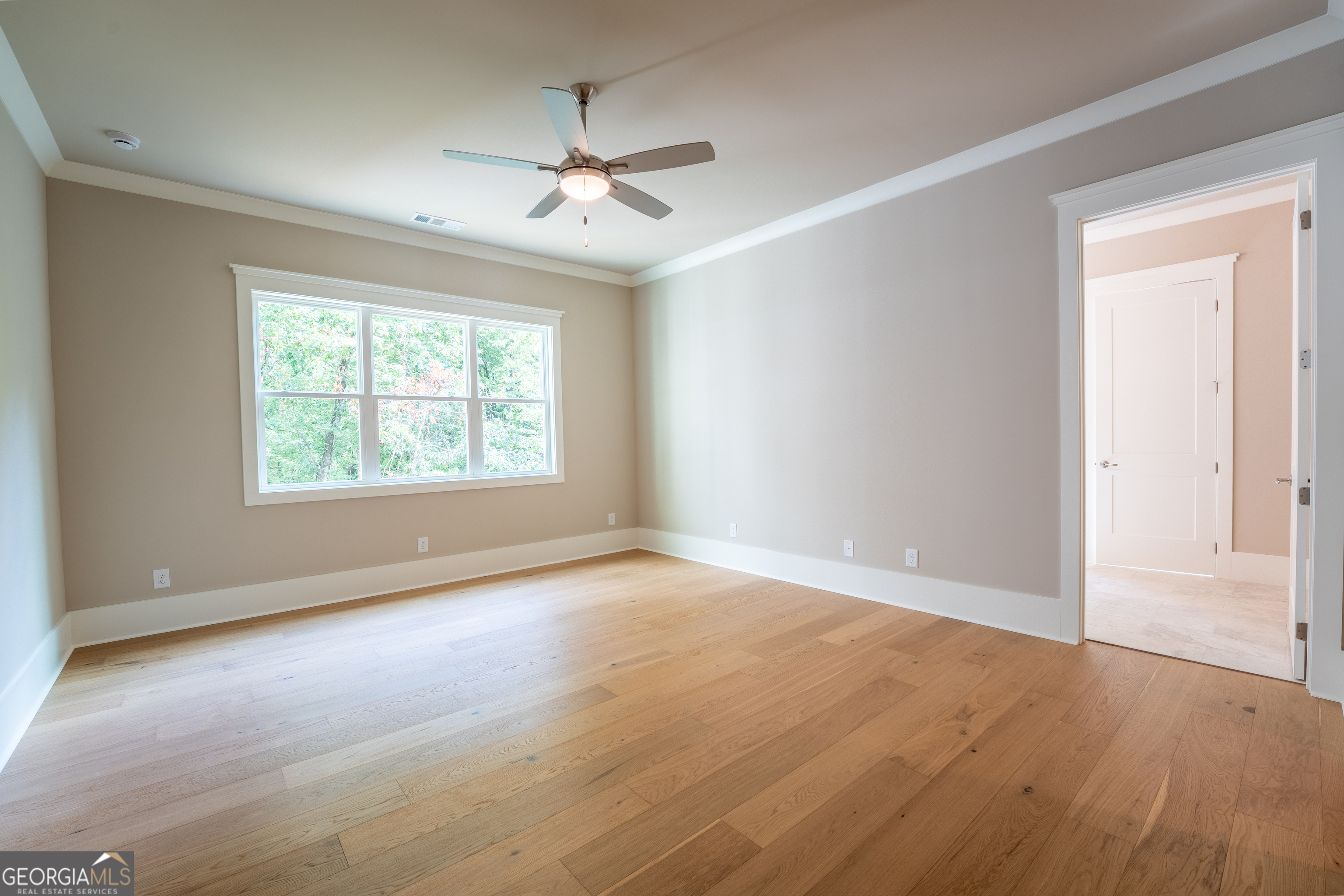 120 Fall Pippin Court Clarkesville, GA 30523 - Photo 29 of 65 an empty room with wooden floor chandelier and windows