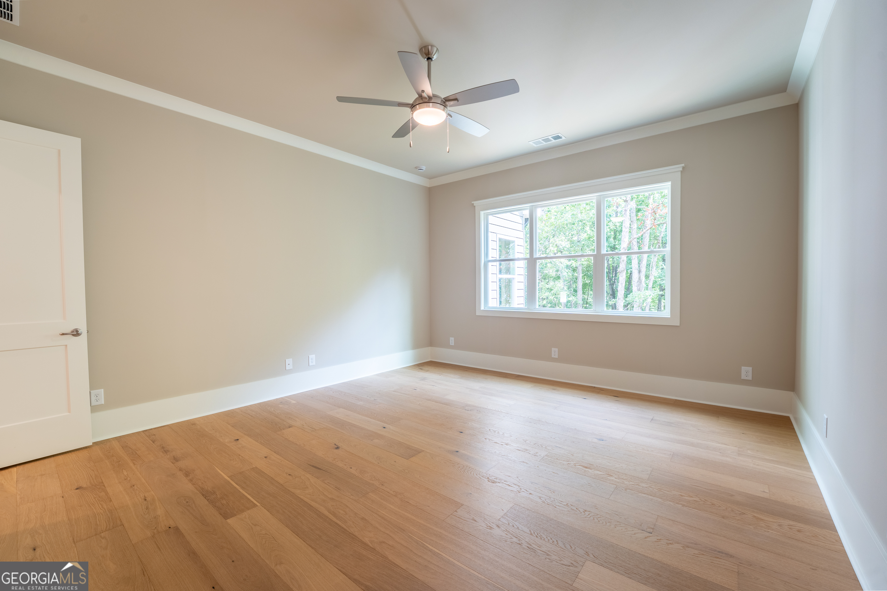 120 Fall Pippin Court Clarkesville, GA 30523 - Photo 30 of 65 an empty room with wooden floor fan and windows