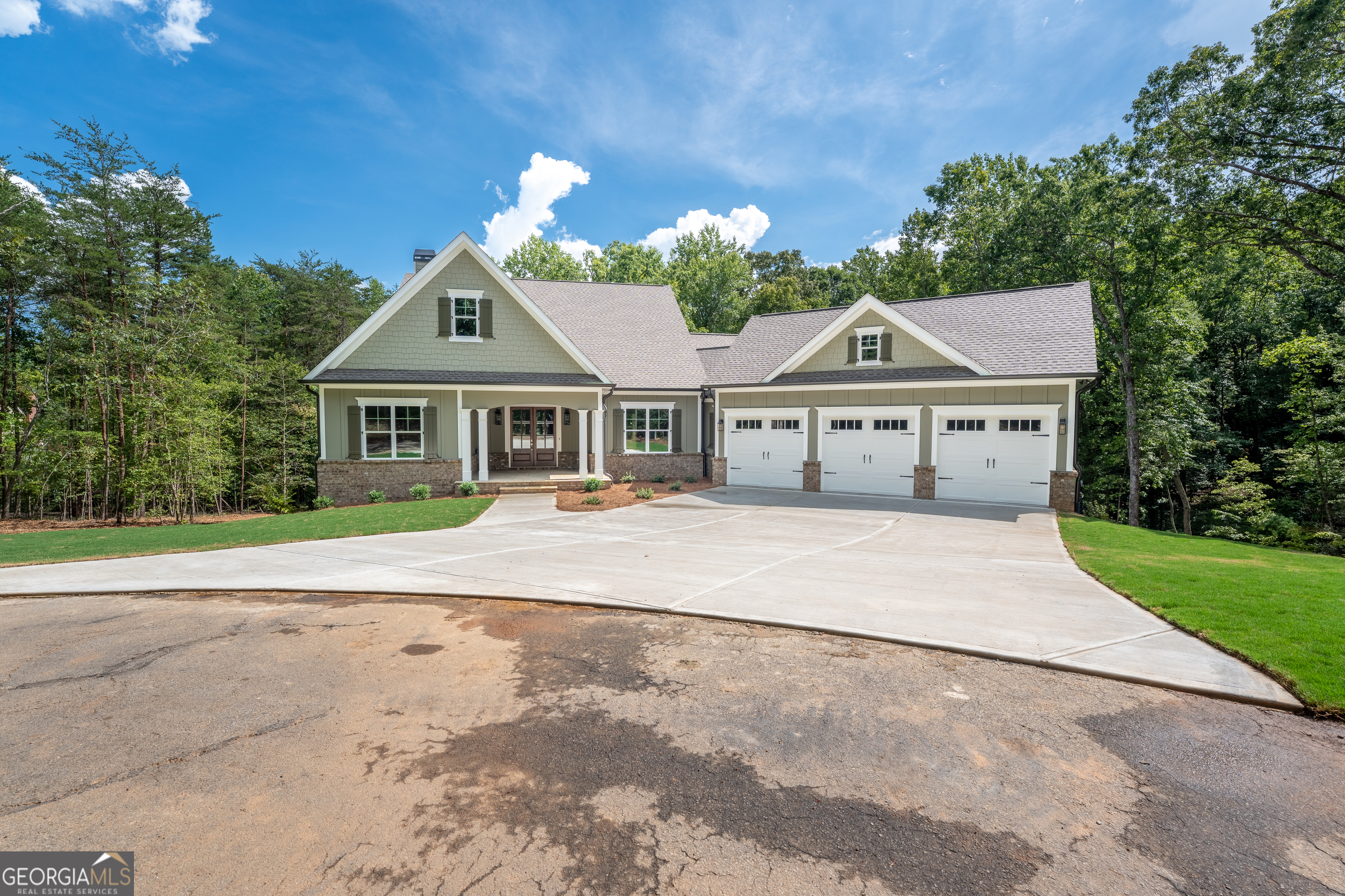 120 Fall Pippin Court Clarkesville, GA 30523 - Photo 3 of 65 a front view of a house with a garden