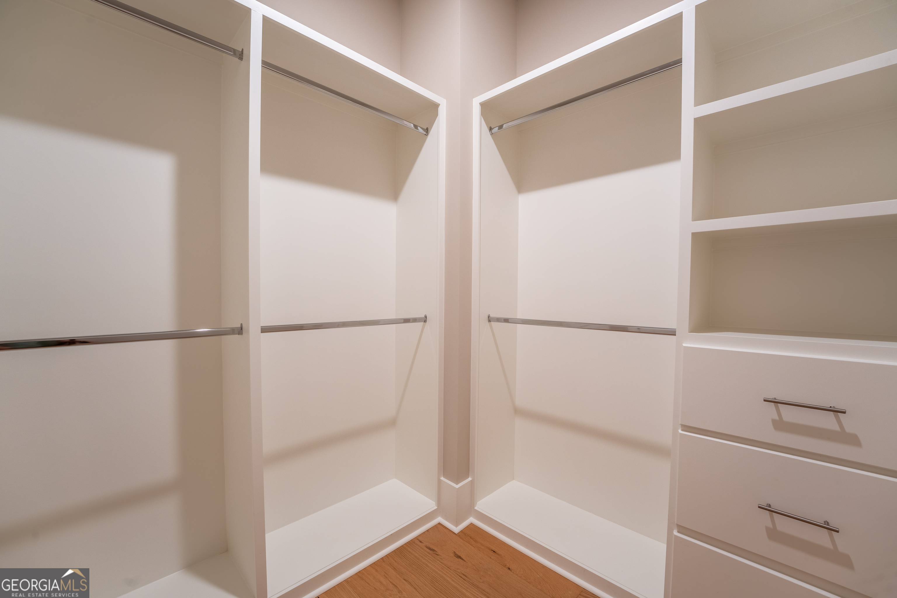 120 Fall Pippin Court Clarkesville, GA 30523 - Photo 32 of 65 a view of walk in closet with empty racks