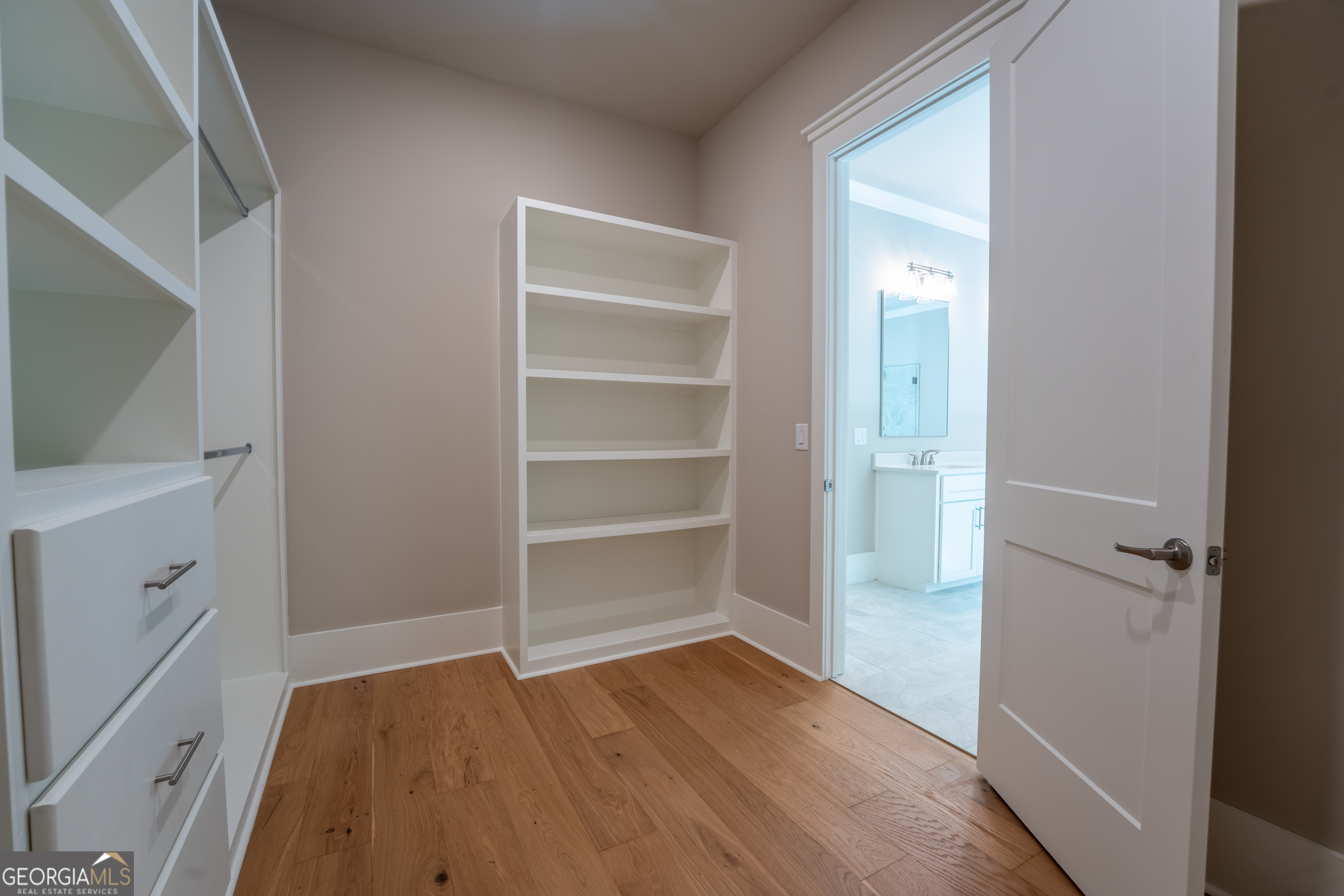 120 Fall Pippin Court Clarkesville, GA 30523 - Photo 38 of 65 a view of walk in closet with empty racks