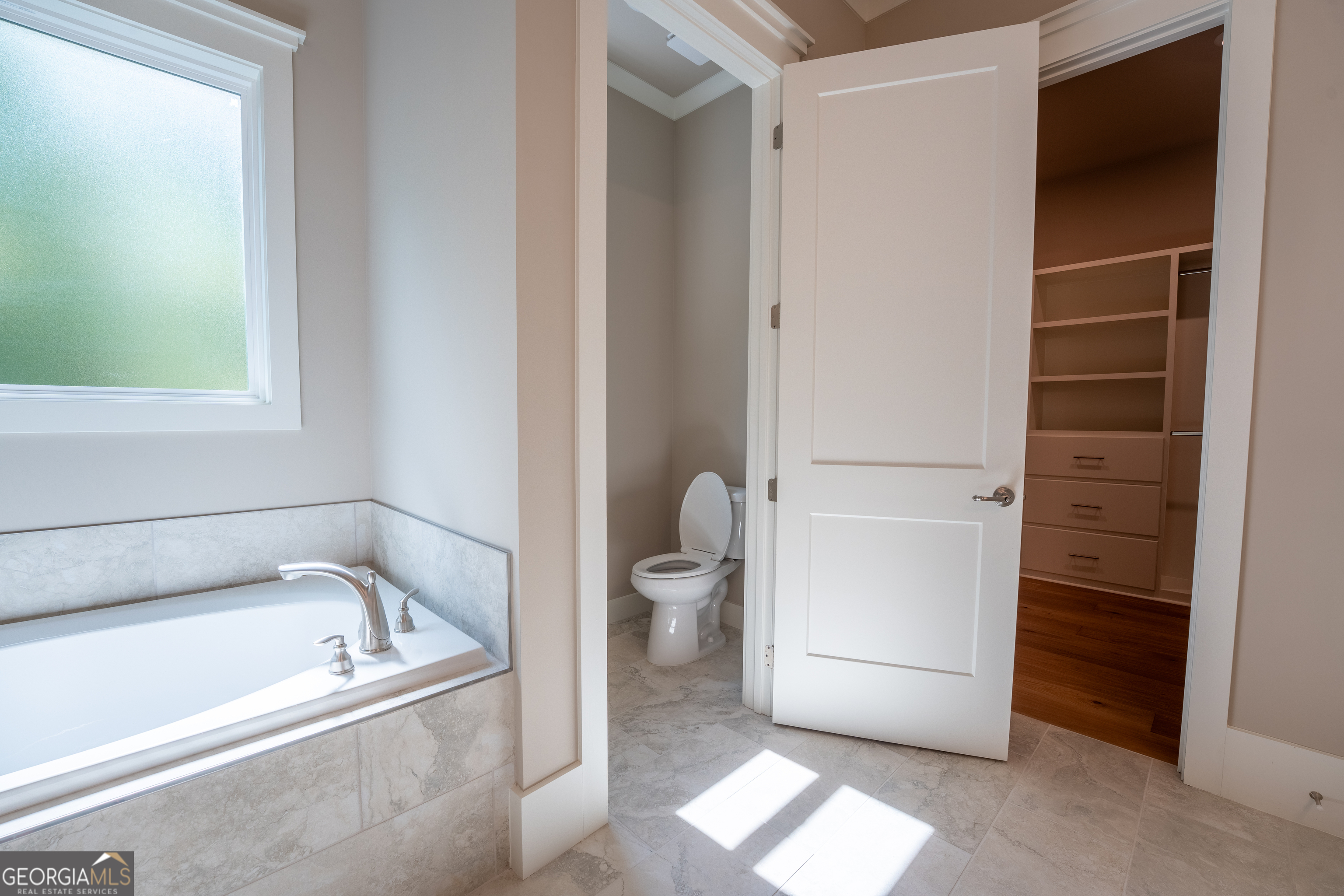 120 Fall Pippin Court Clarkesville, GA 30523 - Photo 39 of 65 a bathroom with a bathtub and a toilet