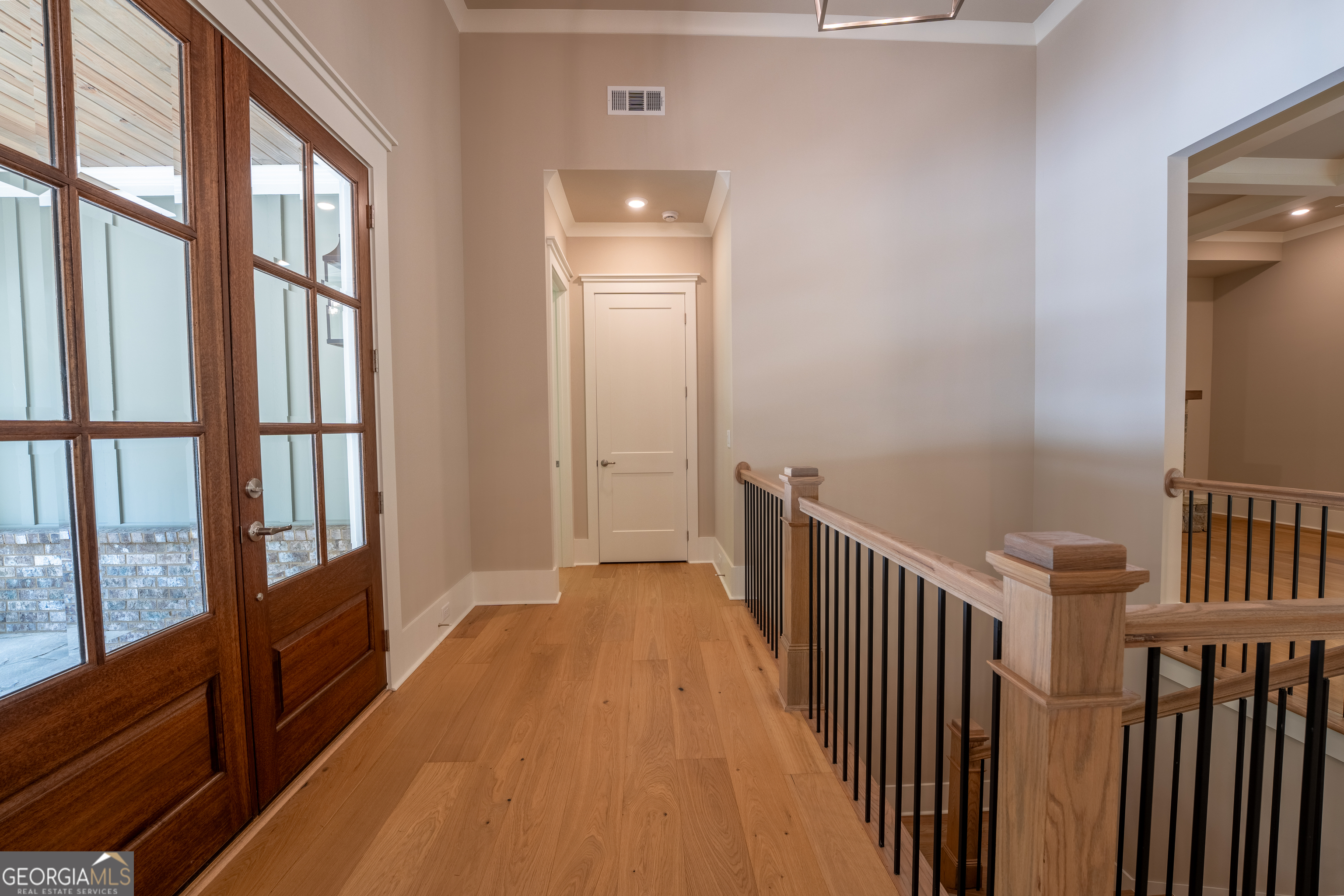 120 Fall Pippin Court Clarkesville, GA 30523 - Photo 40 of 65 a view of hallway with wooden floor and stairs