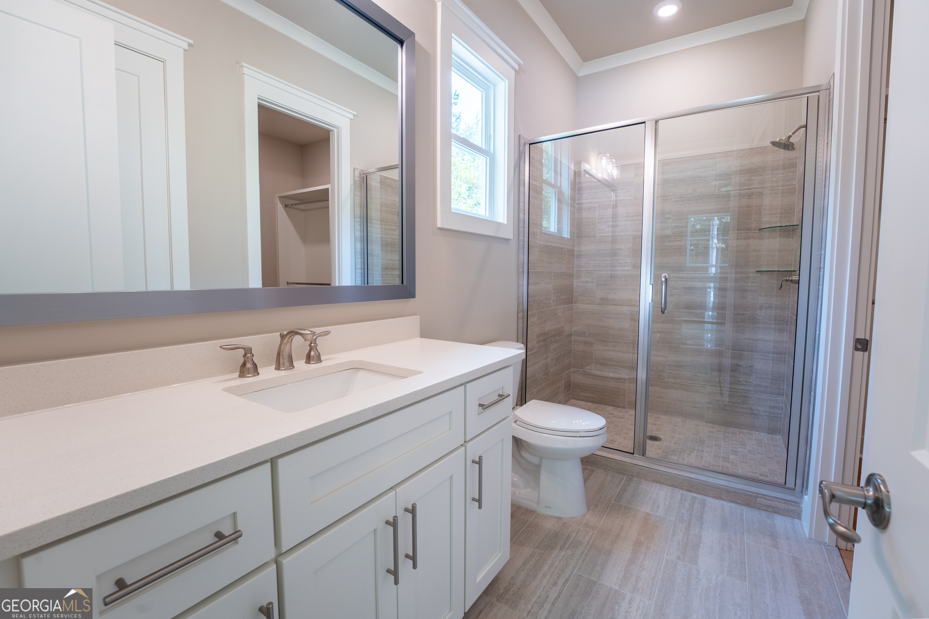 120 Fall Pippin Court Clarkesville, GA 30523 - Photo 47 of 65 a bathroom with a double vanity sink toilet and shower
