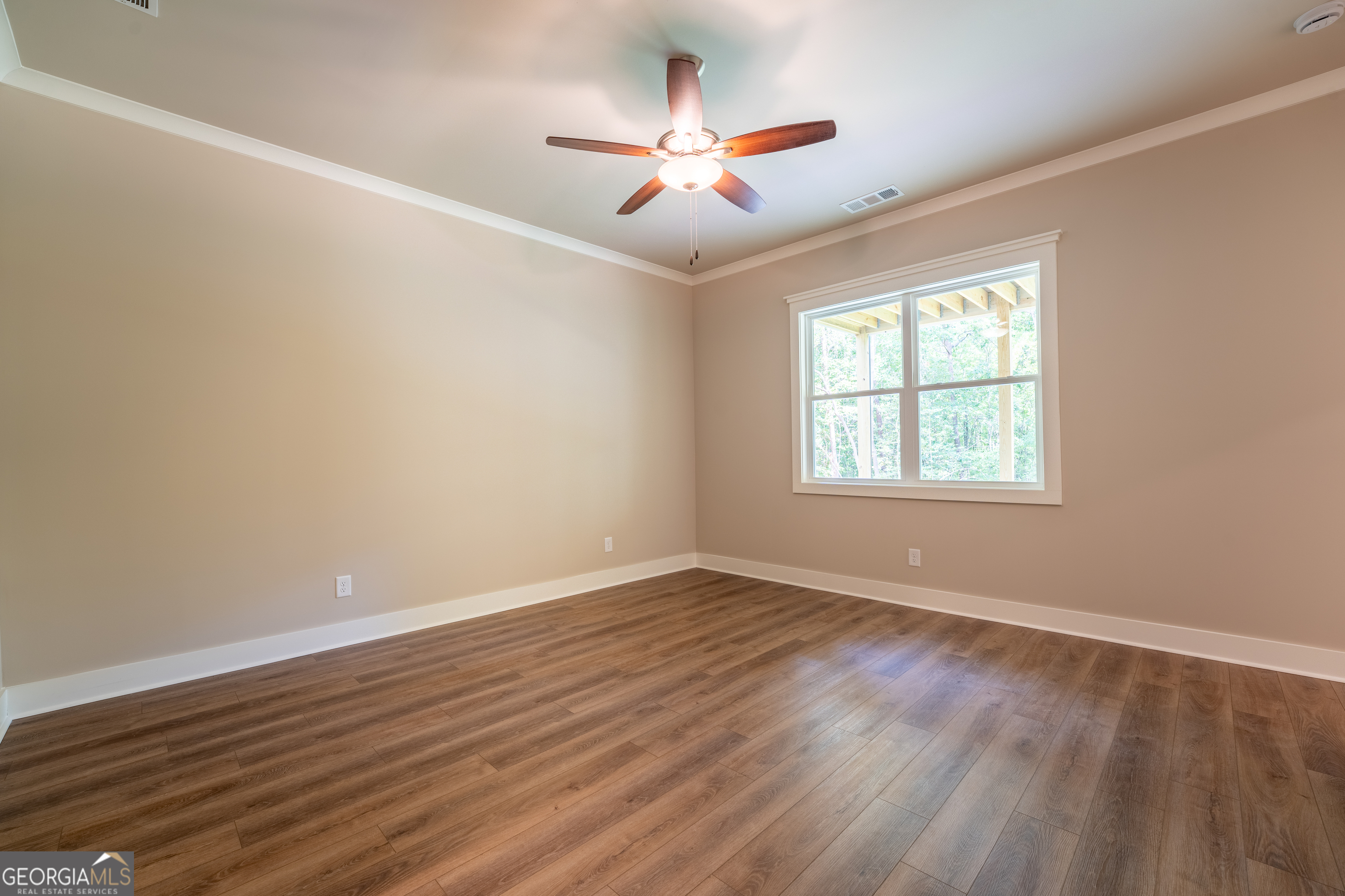 120 Fall Pippin Court Clarkesville, GA 30523 - Photo 52 of 65 an empty room with wooden floor and windows