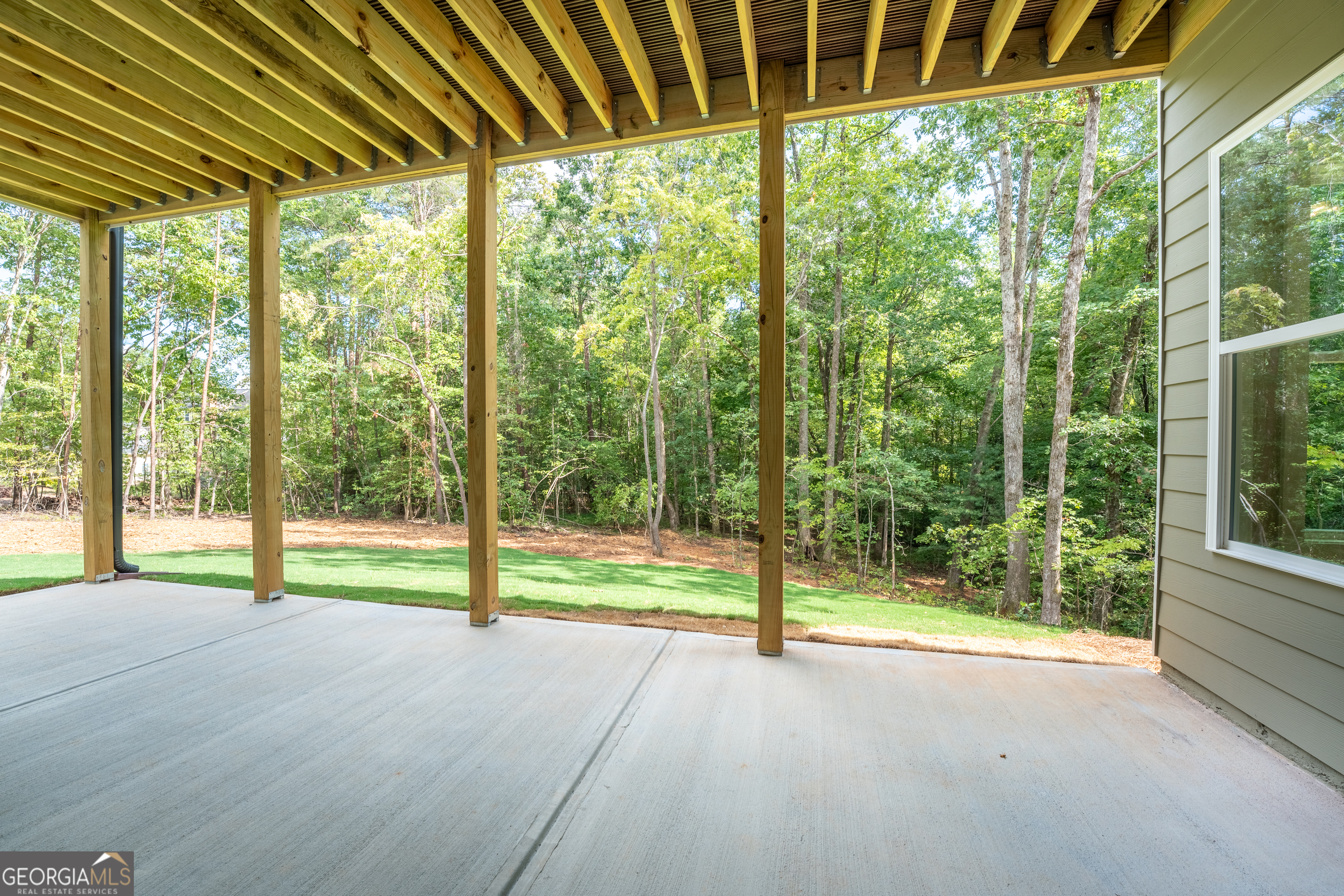 120 Fall Pippin Court Clarkesville, GA 30523 - Photo 58 of 65 a view of empty room with floor to ceiling windows and tree