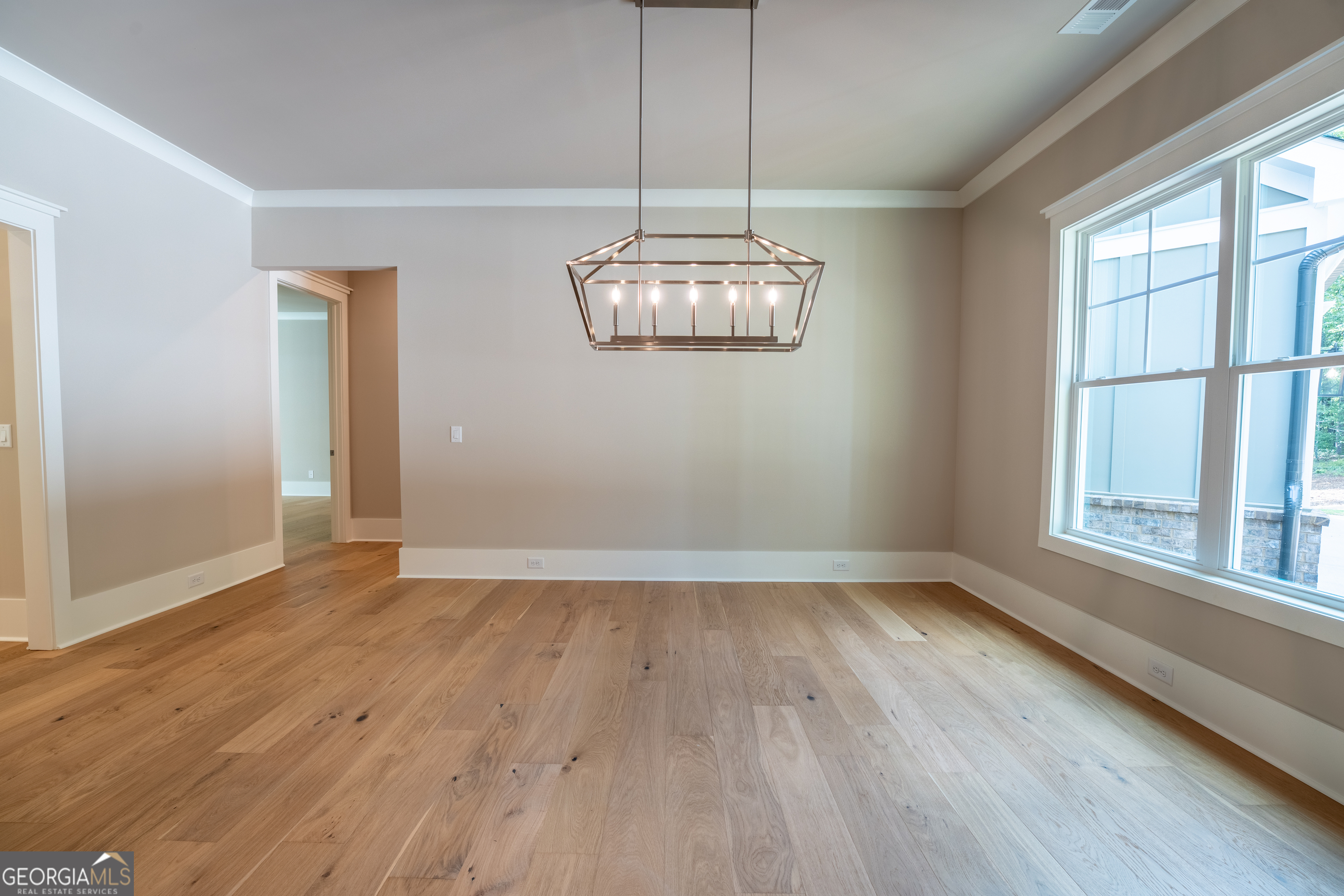 120 Fall Pippin Court Clarkesville, GA 30523 - Photo 6 of 65 wooden floor in an empty room with a window
