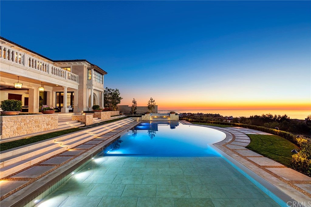 a view of swimming pool with outdoor seating