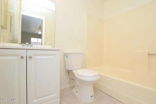 a bathroom with a toilet and a bathtub