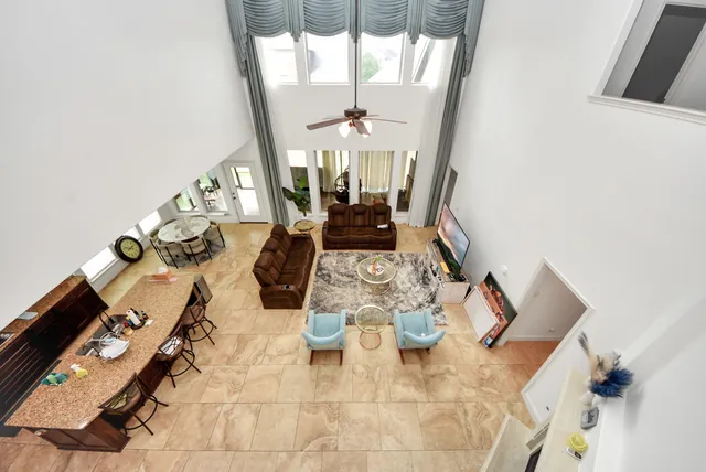 a view of living room with furniture and wooden floor