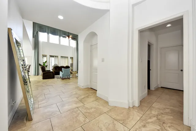 a view of a livingroom with furniture and a bedroom
