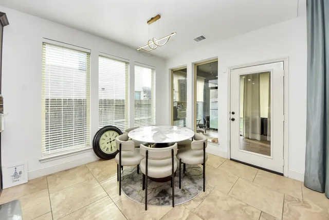 a view of a room with a table and a chair