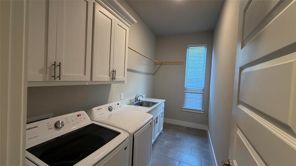 912 Fallbrook Avenue Denton, TX 76210 - Photo 24 of 26 a utility room with dryer and washer