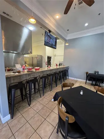 a kitchen with a table and chairs in it