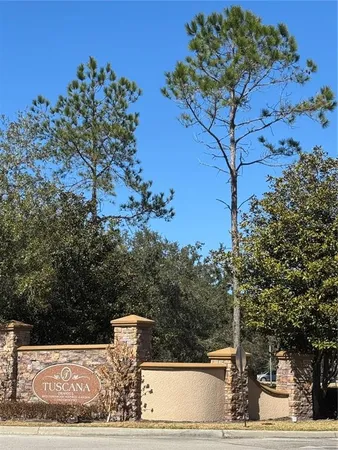 a view of fountain in the middle of a yard