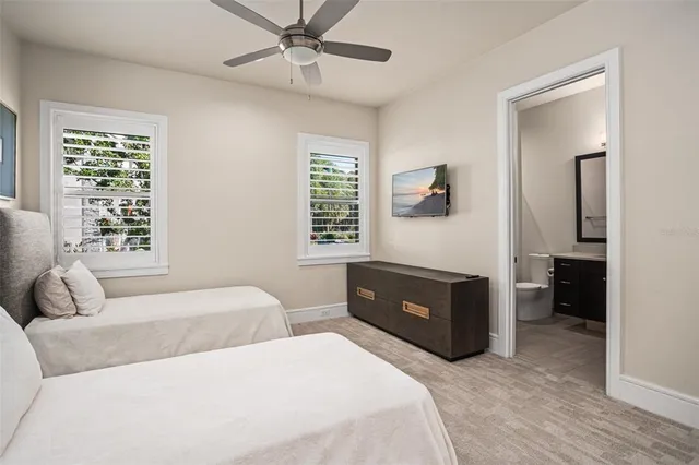 a hallway with furniture and a chandelier