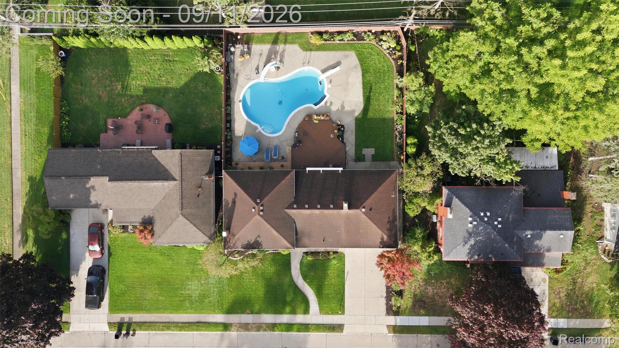 16799 Farmington Road Livonia, MI 48154 - Photo 58 of 71 Detached residential property with a multi-gabled roof, expansive front lawn, and mature trees