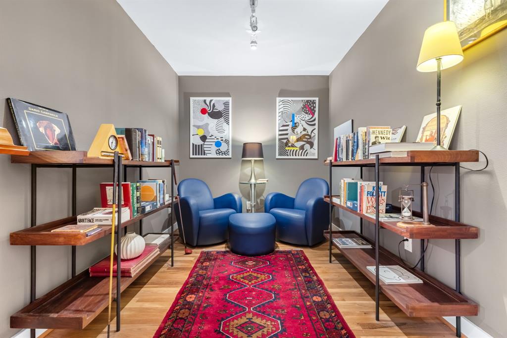 5055 Addison Circle, Unit 733 Addison, TX 75001 - Photo 12 of 40 a living room with furniture a rug and a lamp