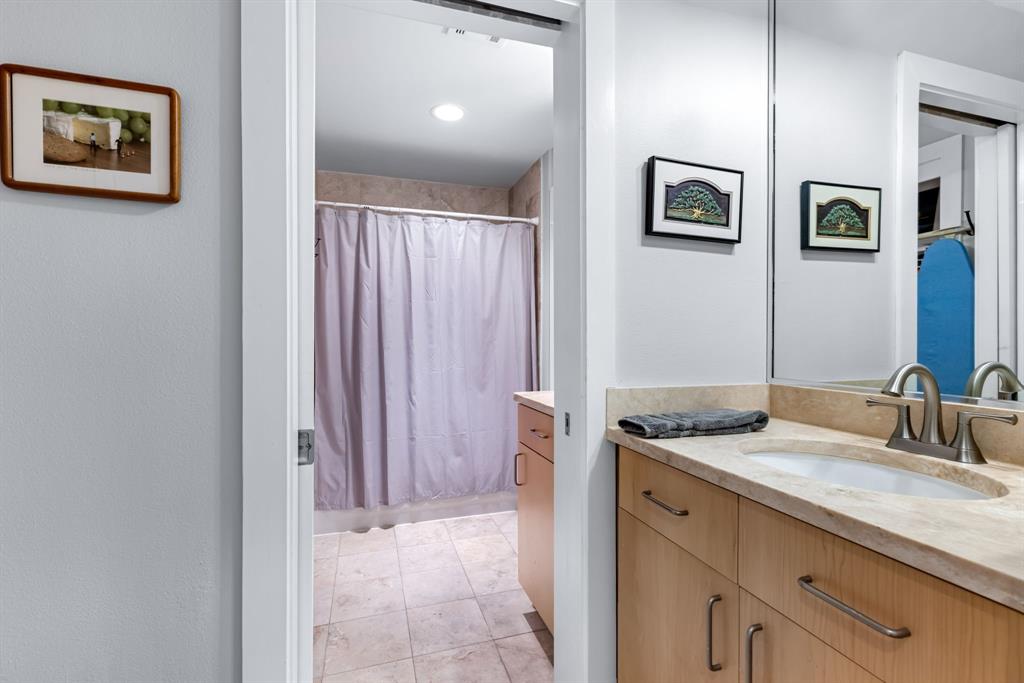 5055 Addison Circle, Unit 733 Addison, TX 75001 - Photo 13 of 40 a bathroom with a sink and a mirror