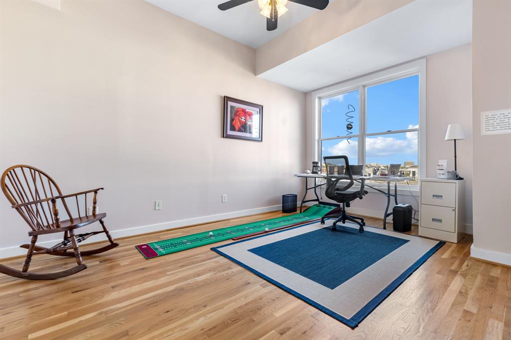 5055 Addison Circle, Unit 733 Addison, TX 75001 - Photo 14 of 40 a room with furniture and a rug