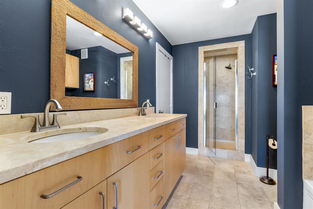 5055 Addison Circle, Unit 733 Addison, TX 75001 - Photo 18 of 40 a bathroom with a double vanity sink and a mirror