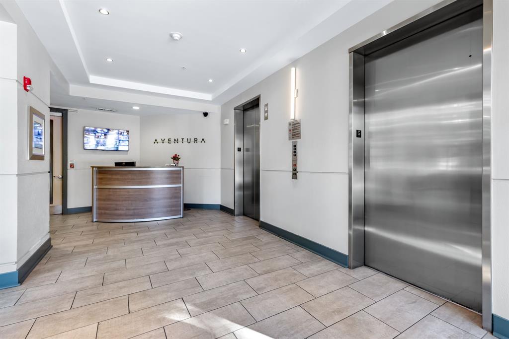 5055 Addison Circle, Unit 733 Addison, TX 75001 - Photo 2 of 40 a kitchen with stainless steel appliances granite countertop a refrigerator and a sink
