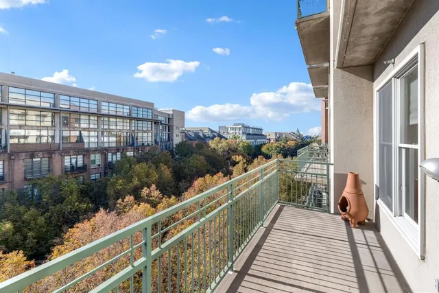 a view of a balcony with wooden floor