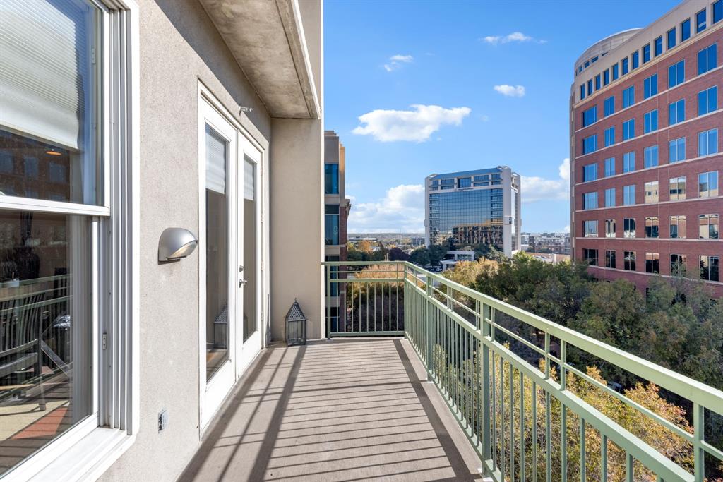 5055 Addison Circle, Unit 733 Addison, TX 75001 - Photo 22 of 40 a view of a balcony with wooden floor