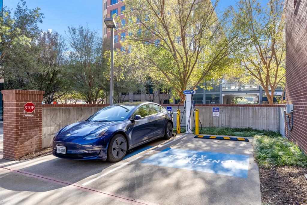 5055 Addison Circle, Unit 733 Addison, TX 75001 - Photo 26 of 40 a car parked in front of a house