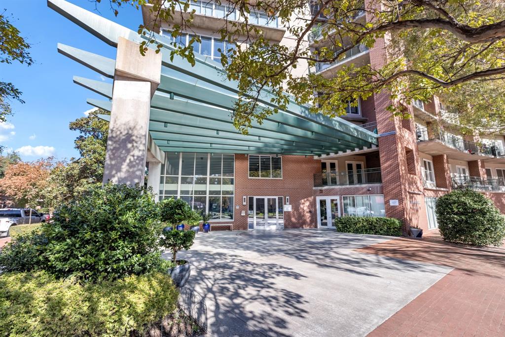 5055 Addison Circle, Unit 733 Addison, TX 75001 - Photo 28 of 40 a front view of a house with garden