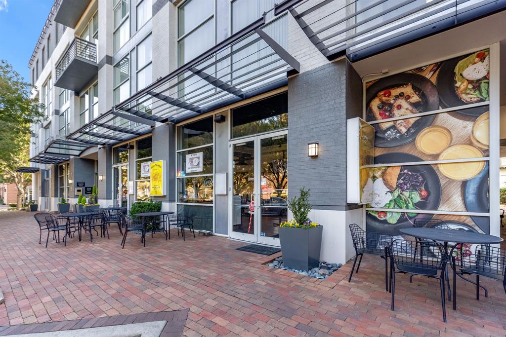 5055 Addison Circle, Unit 733 Addison, TX 75001 - Photo 30 of 40 a view of a dinning tables and chairs in a patio