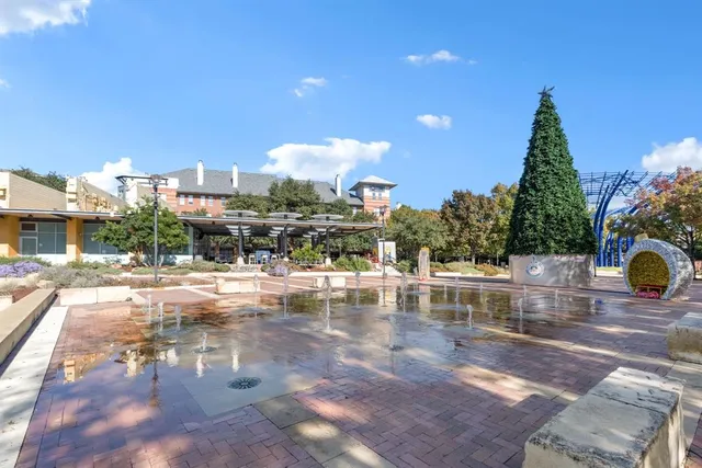 a view of swimming pool with outdoor seating and plants