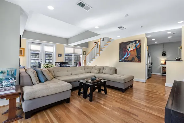 a kitchen with granite countertop a sink and cabinets