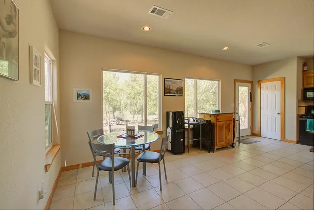 a view of a livingroom with furniture and a fireplace