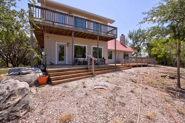 an aerial view of residential house and green space