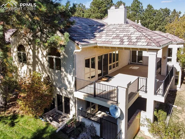 a view of a house with brick walls and windows