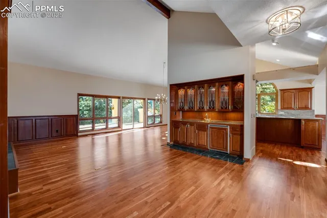 a view of room with window and wooden floor
