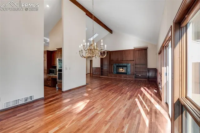 a view of a livingroom with a furniture window and wooden floor