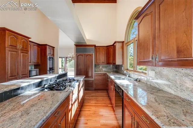 a view of a kitchen with a large window